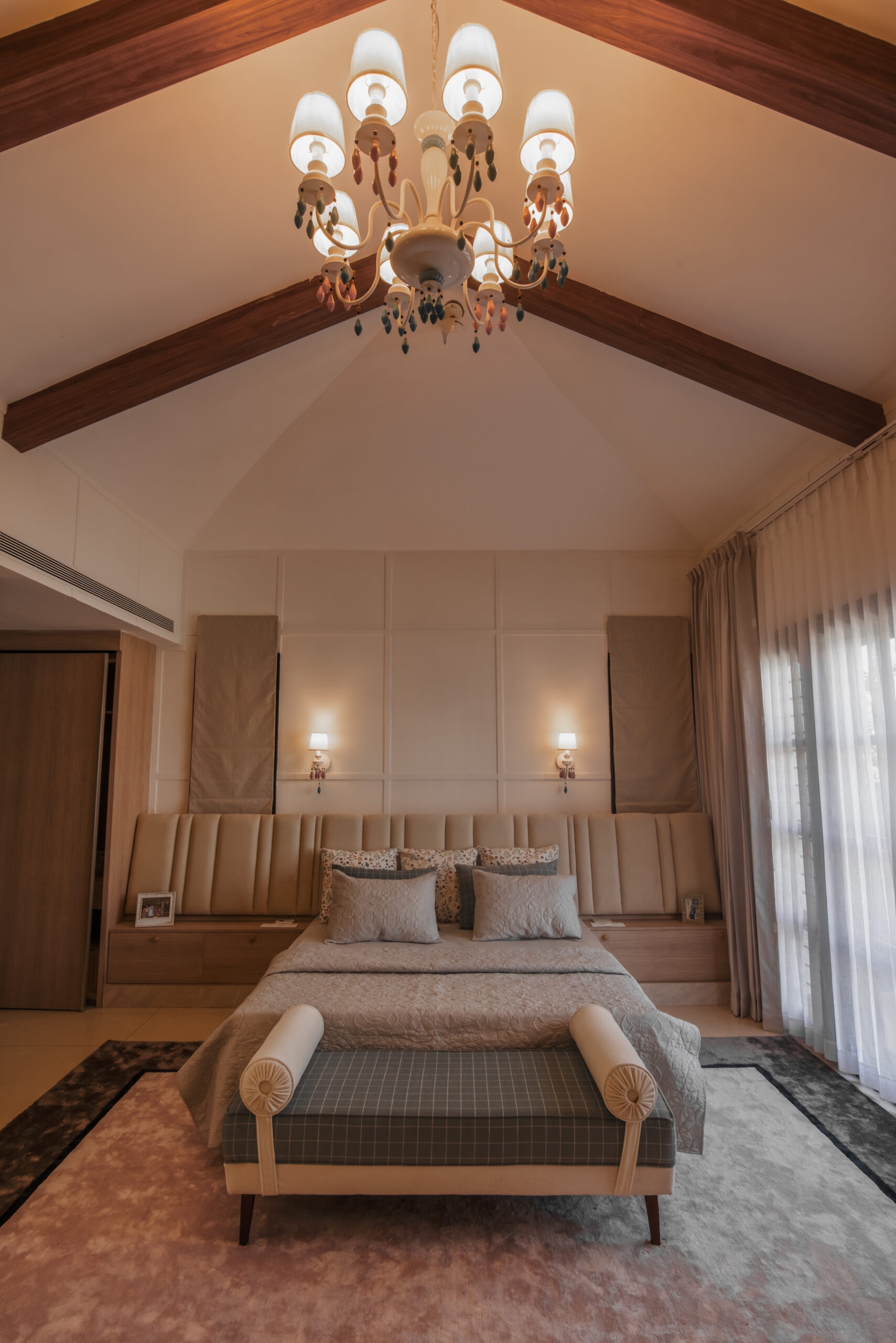 Contemporary bedroom design featuring soft lighting, textured walls, and bespoke wardrobes